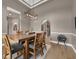 Formal dining room with modern light fixture and open access to the kitchen at 1462 Palm Bay Ct, Lake Mary, FL 32746
