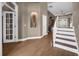 Elegant entryway showcasing hardwood floors, staircase and decorative niche at 1462 Palm Bay Ct, Lake Mary, FL 32746