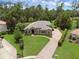 Beautiful home with brick driveway, lush landscaping, and manicured lawn at 1462 Palm Bay Ct, Lake Mary, FL 32746