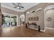 Spacious hallway with hardwood floors, arched alcoves, and access to outdoor living at 1462 Palm Bay Ct, Lake Mary, FL 32746