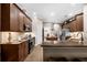 Spacious kitchen with granite countertops, dark wood cabinetry, and stainless steel appliances at 1462 Palm Bay Ct, Lake Mary, FL 32746