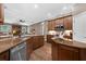Gourmet kitchen features granite countertops, stainless steel appliances, and wood flooring at 1462 Palm Bay Ct, Lake Mary, FL 32746