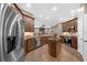 Spacious kitchen features stainless steel appliances, wooden floors, and granite countertops at 1462 Palm Bay Ct, Lake Mary, FL 32746