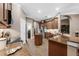 Bright kitchen featuring wood cabinets, granite countertops, stainless steel appliances, and modern fixtures at 1462 Palm Bay Ct, Lake Mary, FL 32746