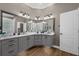 Stylish bathroom with dual sinks, granite countertops, and gray cabinetry at 1462 Palm Bay Ct, Lake Mary, FL 32746