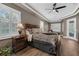 Main bedroom features a stylish decorative theme with tray ceiling and access door at 1462 Palm Bay Ct, Lake Mary, FL 32746