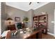 Cozy home office featuring a large desk, built-in shelves, and natural light at 1462 Palm Bay Ct, Lake Mary, FL 32746