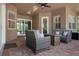 Inviting outdoor seating area with wicker furniture and a fire pit, perfect for relaxing and entertaining at 1462 Palm Bay Ct, Lake Mary, FL 32746