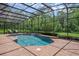 Captivating view of the screened-in pool area, showcasing the peaceful backyard oasis at 1462 Palm Bay Ct, Lake Mary, FL 32746