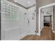 Modern shower stall featuring a glass enclosure, marble surround, and stylish fixtures at 1462 Palm Bay Ct, Lake Mary, FL 32746