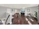 A game room with foosball table, dark wood floors, and a table with seating at 16158 Point Rock, Winter Garden, FL 34787