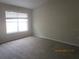 Bedroom featuring neutral carpet and a large window with natural light at 1960 Legacy Cove Dr, Maitland, FL 32751