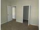 Bedroom featuring neutral carpet, closet, and multiple access doors at 1960 Legacy Cove Dr, Maitland, FL 32751