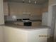 Kitchen featuring lots of cabinets, modern appliances, and a convenient breakfast bar at 1960 Legacy Cove Dr, Maitland, FL 32751