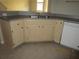 Kitchen featuring stainless steel sink, light wood cabinets and an overhead light at 1960 Legacy Cove Dr, Maitland, FL 32751