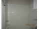 Bright shower with white tile surround and updated faucet fixture at 1960 Legacy Cove Dr, Maitland, FL 32751