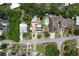 Aerial view of property with solar panels, detached garage, pool, and surrounding neighborhood at 1963 Forest Ave, Daytona Beach, FL 32119