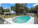 Spacious backyard features an in-ground pool, detached garage, and grass area at 1963 Forest Ave, Daytona Beach, FL 32119
