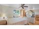 Comfortable bedroom featuring a bed, ceiling fan, and natural light, perfect for relaxation at 1963 Forest Ave, Daytona Beach, FL 32119