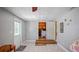 Bonus room with a door leading to the laundry room, gray walls and tile floors at 1963 Forest Ave, Daytona Beach, FL 32119