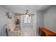 Cozy bonus room with a comfortable armchair, shelving, and a desk area at 1963 Forest Ave, Daytona Beach, FL 32119