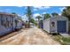 View of the shed and the main house, showing a concrete driveway at 1963 Forest Ave, Daytona Beach, FL 32119