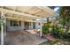 Charming carport area with lush landscaping framing this inviting single Gathering home's front at 1963 Forest Ave, Daytona Beach, FL 32119