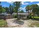 Inviting single-story home featuring a carport, landscaped front yard, and welcoming entryway at 1963 Forest Ave, Daytona Beach, FL 32119