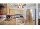 Bright kitchen features light wood cabinets, stainless steel appliances, and neutral tile at 1963 Forest Ave, Daytona Beach, FL 32119