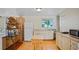 Compact kitchenette features white cabinets, a microwave, a mini-oven, and a refrigerator at 1963 Forest Ave, Daytona Beach, FL 32119