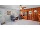 Warm living room showcasing tile floors, wood accents, and comfortable seating arrangement at 1963 Forest Ave, Daytona Beach, FL 32119