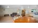 This spacious living area features sleek wood floors, a ceiling fan, and an efficient mini-split AC system at 1963 Forest Ave, Daytona Beach, FL 32119