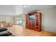 Spacious living area boasts sleek floors, a modern entertainment center, and sliding glass doors to the outside at 1963 Forest Ave, Daytona Beach, FL 32119