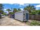 Outdoor shed features a single door entry, AC unit, and simple wood access ramp at 1963 Forest Ave, Daytona Beach, FL 32119