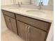 Close-up of a bathroom double vanity with white countertop and modern silver faucets at 2043 Town Pasture Dr, Eustis, FL 32726