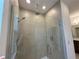 Bathroom featuring a large glass-enclosed shower with grey tile and dual showerheads at 2043 Town Pasture Dr, Eustis, FL 32726