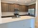 Modern kitchen with stainless steel appliances, ample cabinet space, and large island at 2043 Town Pasture Dr, Eustis, FL 32726
