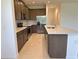Well-equipped kitchen with stainless steel appliances, island and tile backsplash at 2043 Town Pasture Dr, Eustis, FL 32726