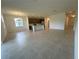 Open-concept living space leading to the kitchen, with tiled floors and natural light at 2043 Town Pasture Dr, Eustis, FL 32726