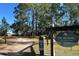 A scenic view of Pine Meadows Conservation Area, with the entrance framed by tall trees and natural beauty at 2075 Town Pasture Dr, Eustis, FL 32726
