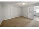 Bedroom with carpet and an en suite kitchen view at 215 Rydalmont Rd, Winter Haven, FL 33884