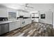 Spacious kitchen with ample white cabinets, stainless steel appliances, and decorative flooring at 215 Rydalmont Rd, Winter Haven, FL 33884