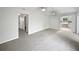 Spacious living room with neutral carpet, fresh paint and ceiling fans at 215 Rydalmont Rd, Winter Haven, FL 33884