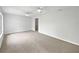 Bright living room featuring neutral paint, carpet and ceiling fans at 215 Rydalmont Rd, Winter Haven, FL 33884