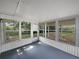 Enclosed sunroom with multiple windows offering plenty of natural light at 215 Rydalmont Rd, Winter Haven, FL 33884