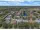 Birds-eye view of neighborhood with ponds and many mature trees at 219 Isle Of Sky Cir, Orlando, FL 32828