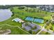 Aerial view showcasing tennis courts, community pool, and surrounding green space, highlighting recreational facilities at 219 Isle Of Sky Cir, Orlando, FL 32828