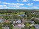 An aerial view of the home surrounded by lush greenery at 219 Isle Of Sky Cir, Orlando, FL 32828
