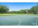 Community basketball court with playground and volleyball area, perfect for recreation and outdoor activities at 219 Isle Of Sky Cir, Orlando, FL 32828