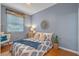 Comfortable bedroom with a cozy bed, stylish decor, and a relaxing atmosphere at 219 Isle Of Sky Cir, Orlando, FL 32828